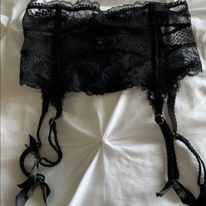 Black lace stocking suspenders.